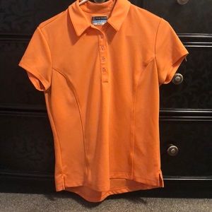 Orange women’s golf polo.